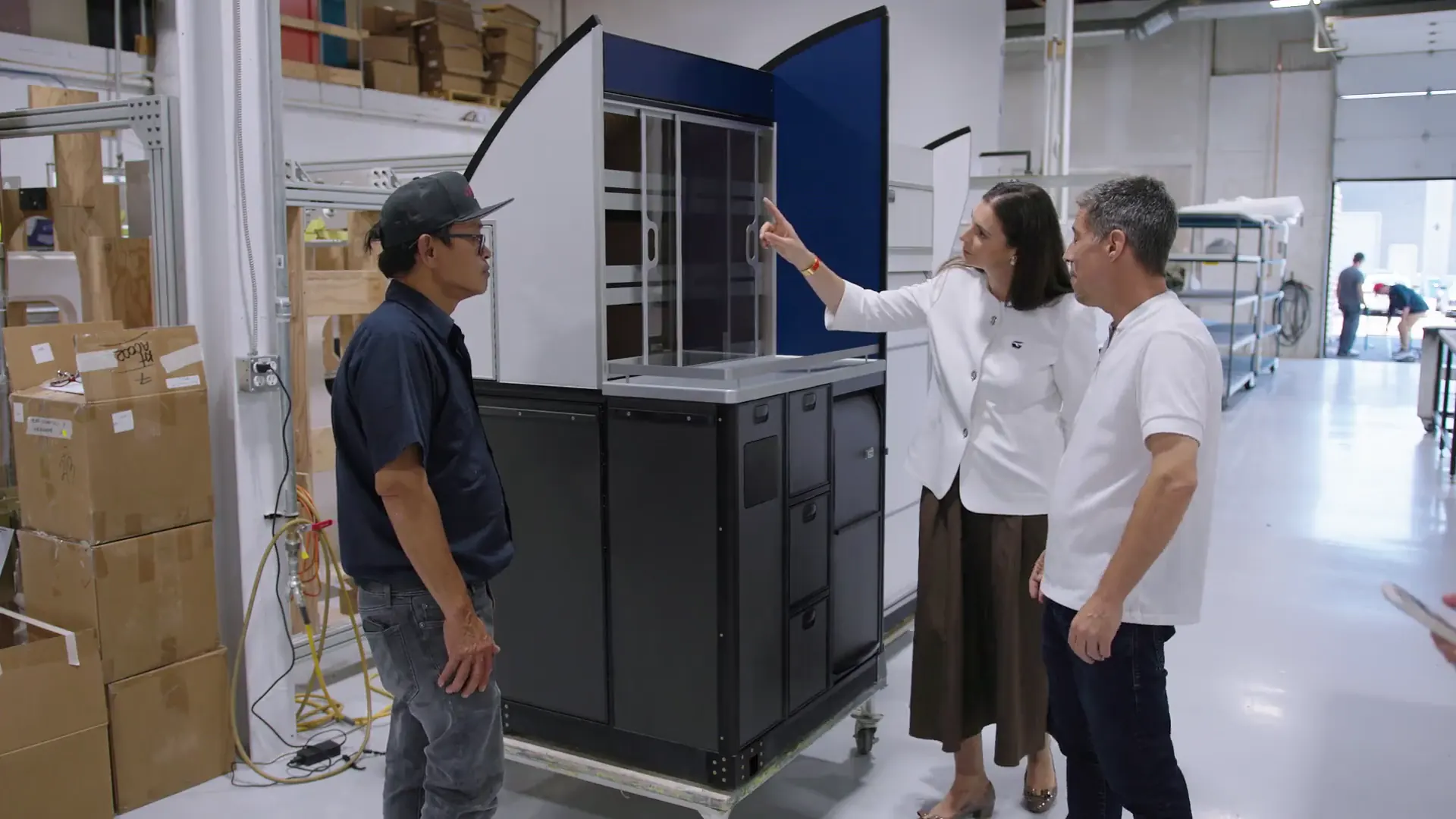 GAL Aerospace team members inspecting an aircraft cabin galley unit in the company's manufacturing facility